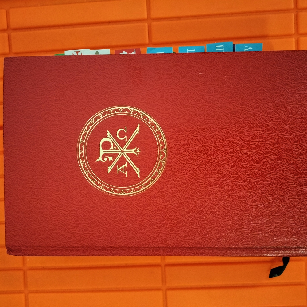 Red Embossed Book with Gold Emblem Roman Missal